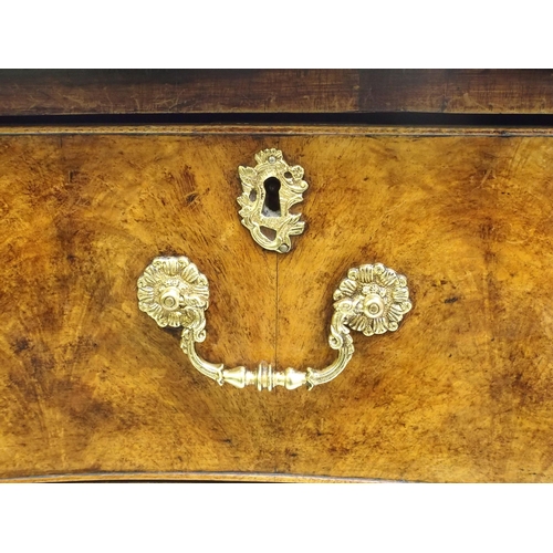 762 - A George III style mahogany serpentine chest