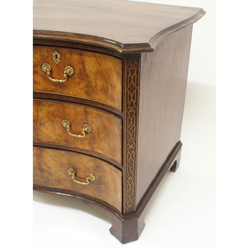 762 - A George III style mahogany serpentine chest