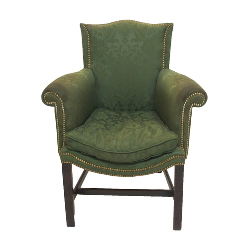 766 - A George III upholstered and brass studded wing armchair