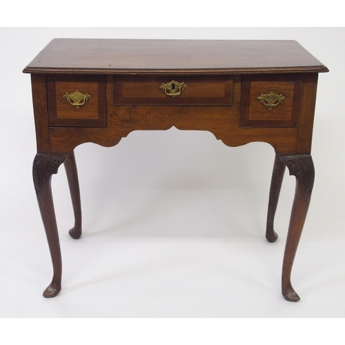 818 - A Georgian crossbanded mahogany and yew lowboy