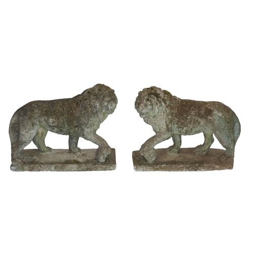 822 - A pair of garden lion ornaments