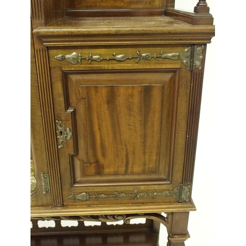 838 - An Arts and Crafts mahogany and foliate inlaid display cabinet