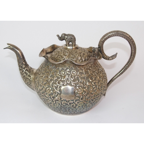 84 - An Indian silver teapot and cover