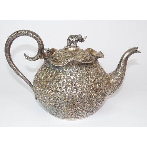 84 - An Indian silver teapot and cover