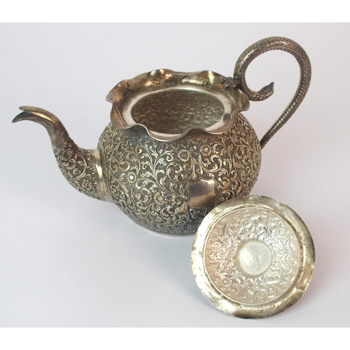 84 - An Indian silver teapot and cover