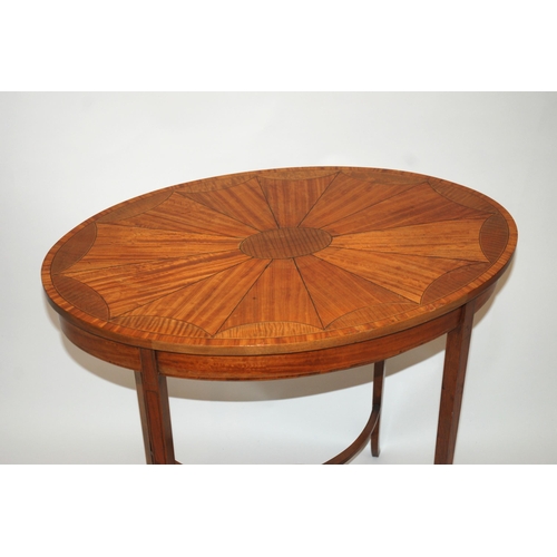 845 - An Edwardian satinwood and ebony strung oval occasional table