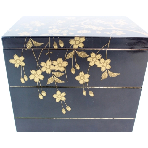 89 - A Japanese black and gold lacquered square three tier box and cover