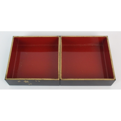 89 - A Japanese black and gold lacquered square three tier box and cover