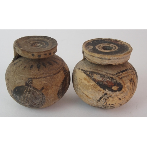 98 - Four pottery oil lamps