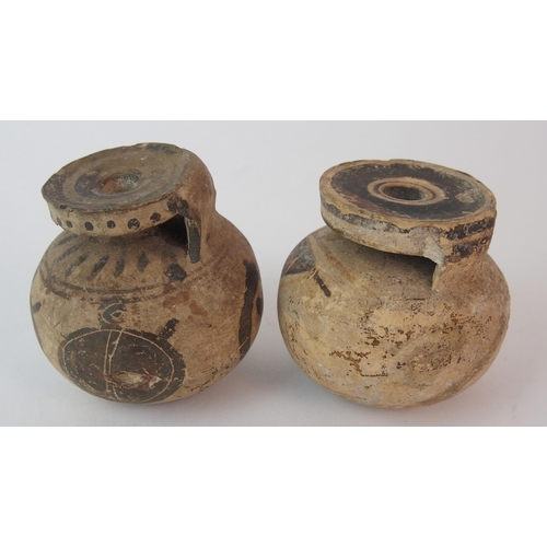 98 - Four pottery oil lamps