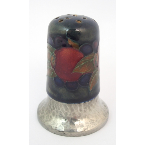 157 - A Moorcroft Pottery Tudric Pomegranate mustard pot and pepper shaker