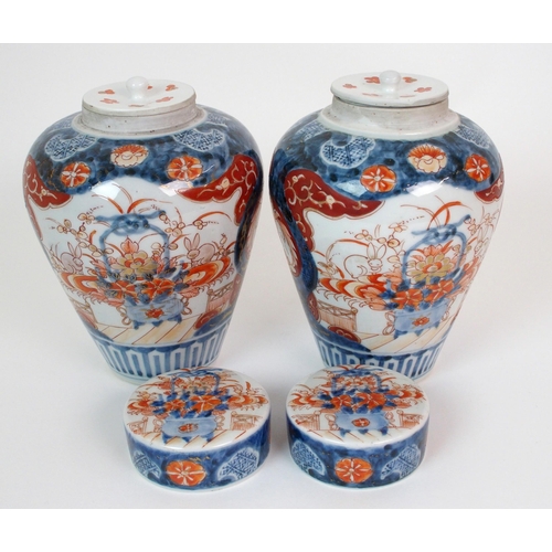 16 - A pair of Imari baluster vases  covers and liners