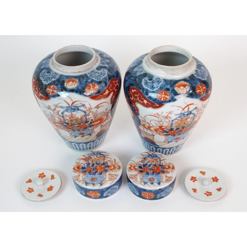 16 - A pair of Imari baluster vases  covers and liners