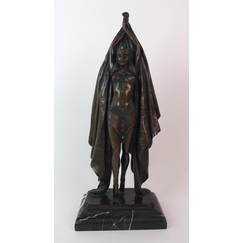 180 - An Orientalist patinated cast bronze figure of a dancer