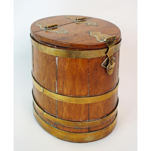 211 - An oak and brass bound lidded box