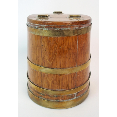 211 - An oak and brass bound lidded box