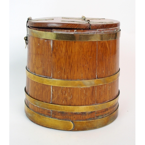 211 - An oak and brass bound lidded box