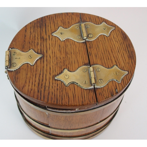 211 - An oak and brass bound lidded box