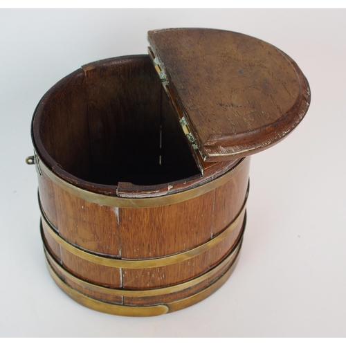 211 - An oak and brass bound lidded box