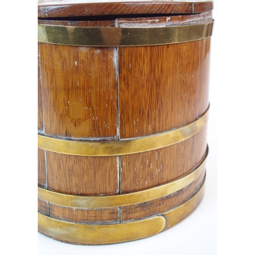 211 - An oak and brass bound lidded box