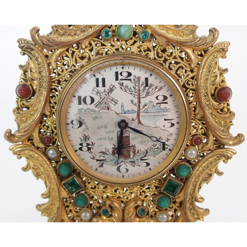 214 - A French Brevete gilt metal filigree clock and associated mirrored compact