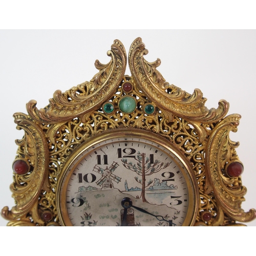 214 - A French Brevete gilt metal filigree clock and associated mirrored compact