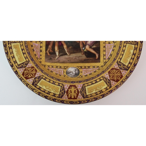 221 - A Viennese painted and enamelled porcelain cabinet plate