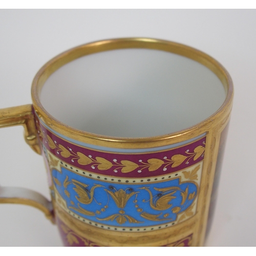 223 - A Viennese painted porcelain handled cup