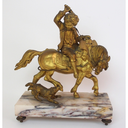 224 - A Continental gilt bronze figure of a boy on horseback