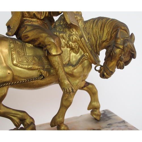 224 - A Continental gilt bronze figure of a boy on horseback