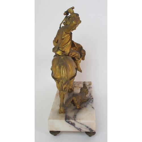 224 - A Continental gilt bronze figure of a boy on horseback