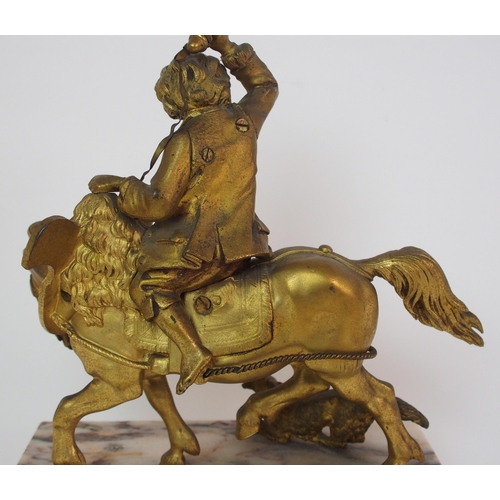 224 - A Continental gilt bronze figure of a boy on horseback