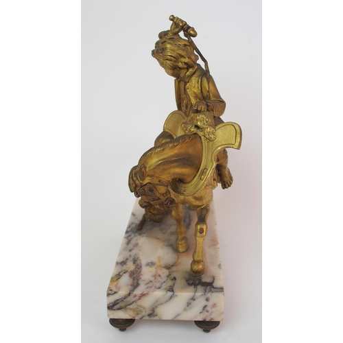 224 - A Continental gilt bronze figure of a boy on horseback