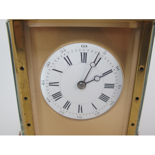 228 - A brass and glass repeater carriage clock