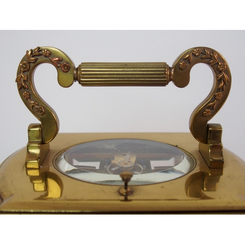 228 - A brass and glass repeater carriage clock