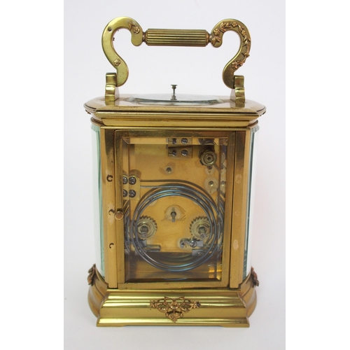 228 - A brass and glass repeater carriage clock