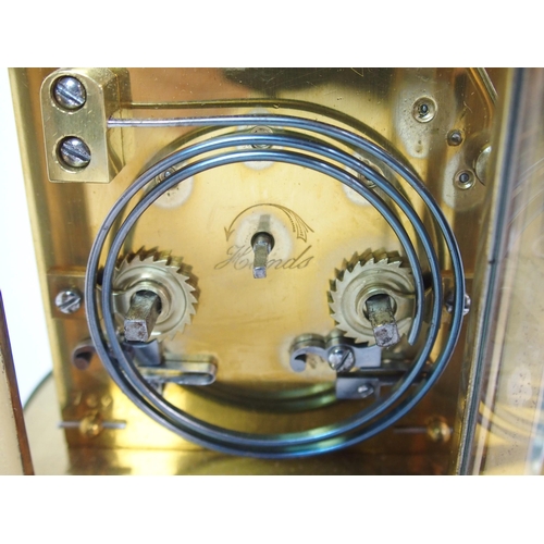 228 - A brass and glass repeater carriage clock