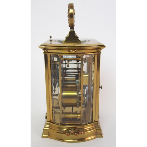 228 - A brass and glass repeater carriage clock