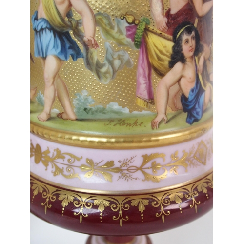 229 - A pair of Viennese painted porcelain footed vases