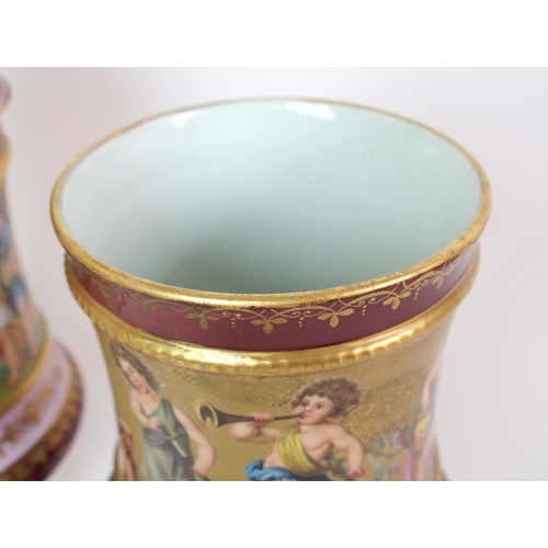 229 - A pair of Viennese painted porcelain footed vases