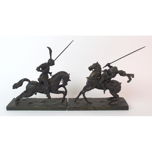 234 - A pair of cast patinated bronze figures