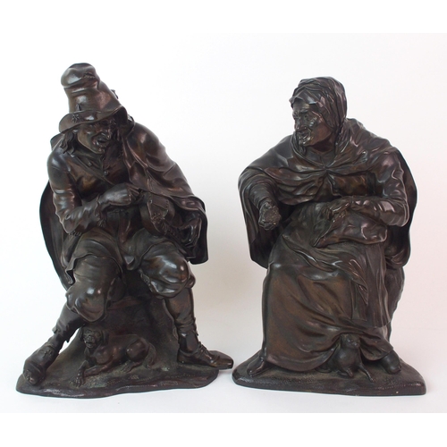 235 - A pair of patinated cast bronze figures