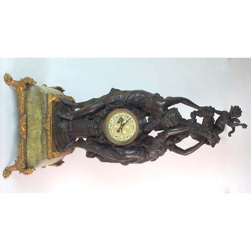 236 - A French patinated spelter  gilt bronze and onyx figural clock