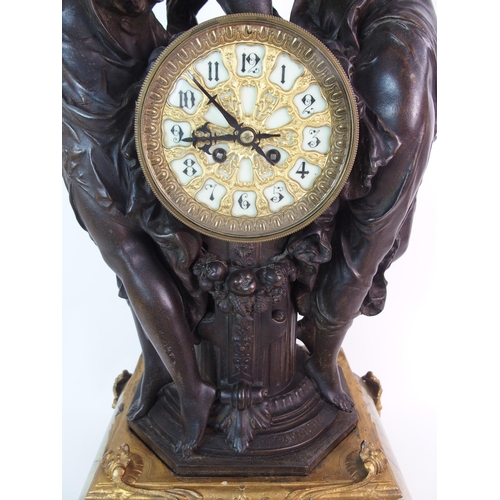 236 - A French patinated spelter  gilt bronze and onyx figural clock