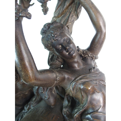 236 - A French patinated spelter  gilt bronze and onyx figural clock