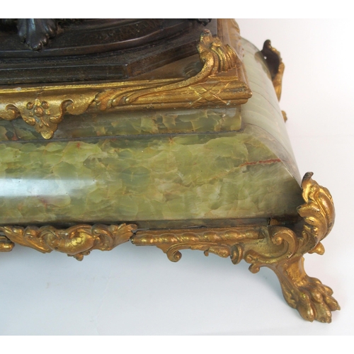 236 - A French patinated spelter  gilt bronze and onyx figural clock