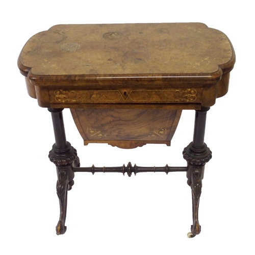 303 - A Victorian walnut inlaid games and sewing table