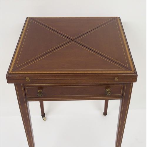 306 - An Edwardian mahogany and crossbanded envelope card table