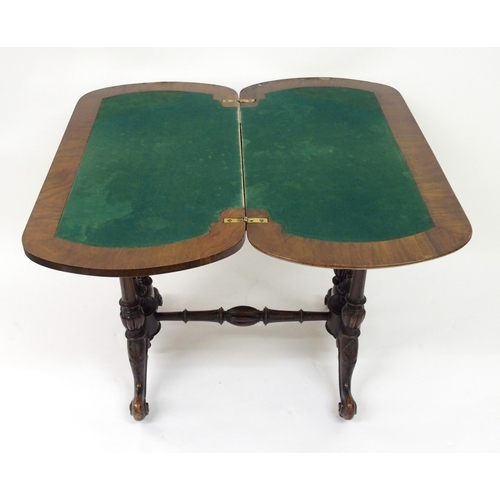 307 - A Victorian walnut card table