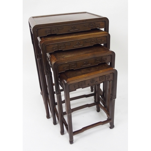 309 - A Chinese hardwood nest of four tables